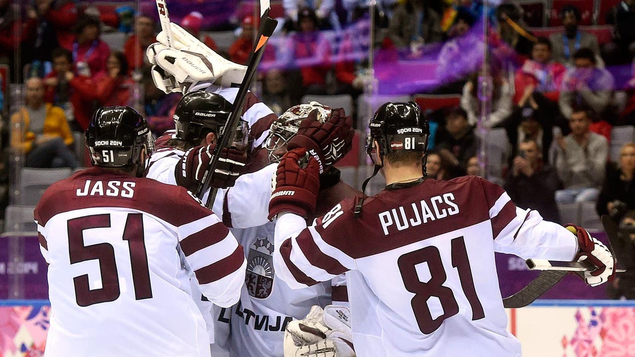Latvia upsets Swiss, will face Canada in quarters